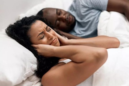 Is Your Spouse a Heroic Snorer? 3 Tips to Quieter Sleep