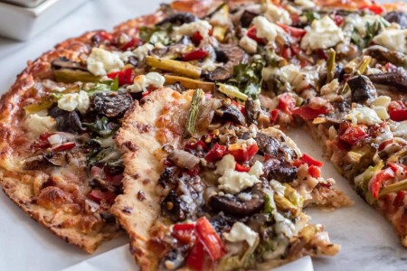 Recipe: Pizza With Arugula, Sautéed Veggies and Goat Cheese