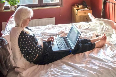 If You Simply Must Work From Bed, Here’s What to Consider