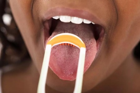 Does Tongue Scraping Actually Work, and Should I Be Doing It?