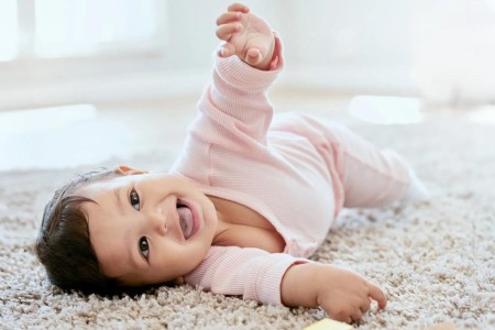 When Babies Start To Roll Over (and How To Encourage It)
